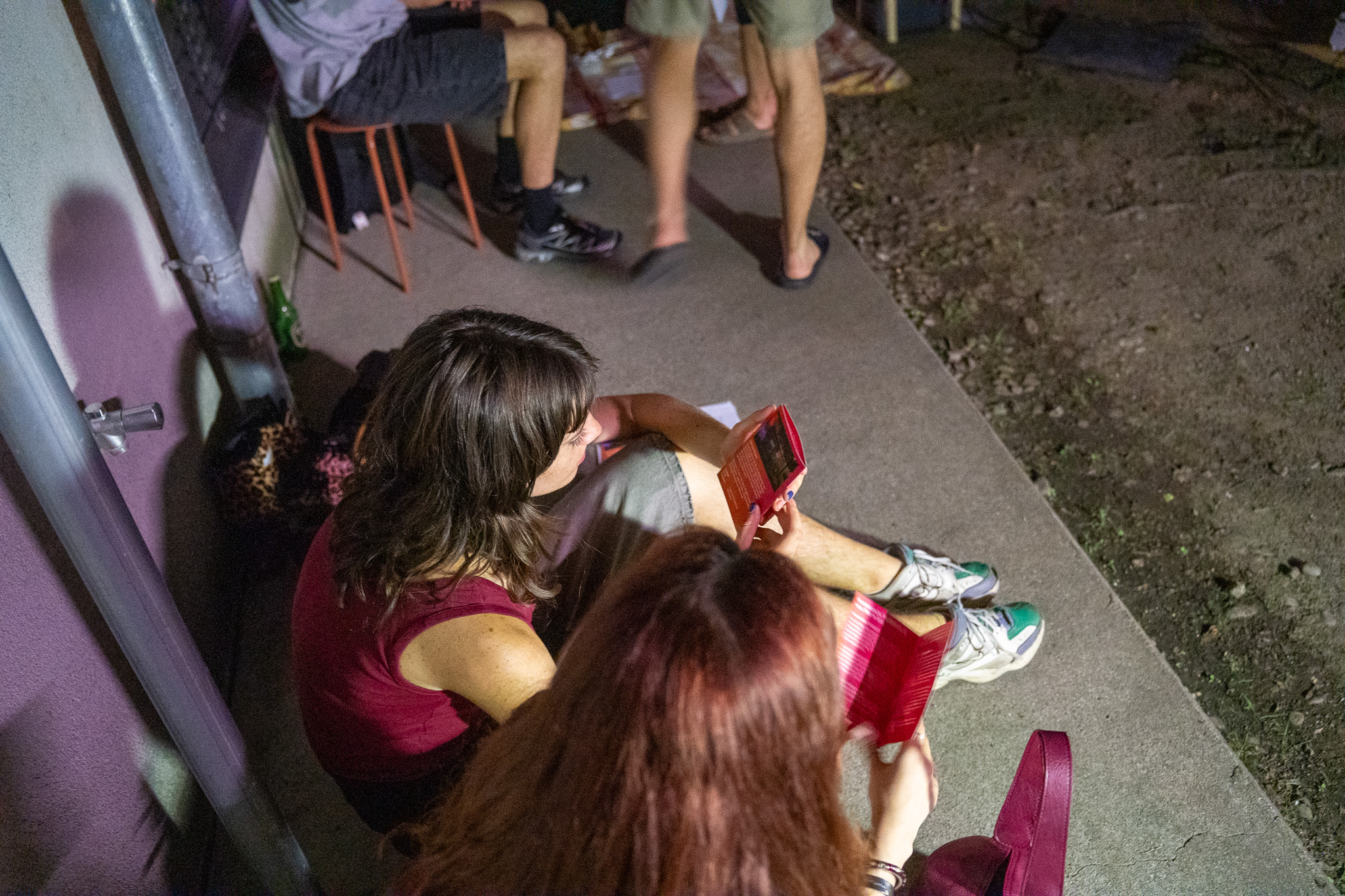 Visitors reading the printed programme