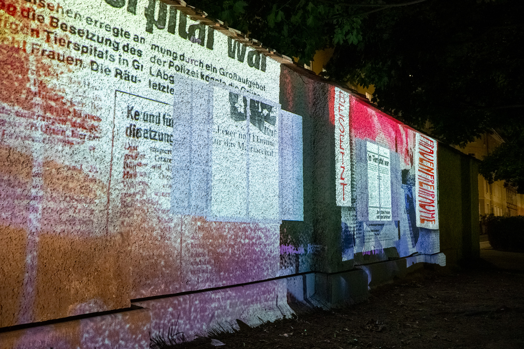 Projected newspaper clippings about the occupation