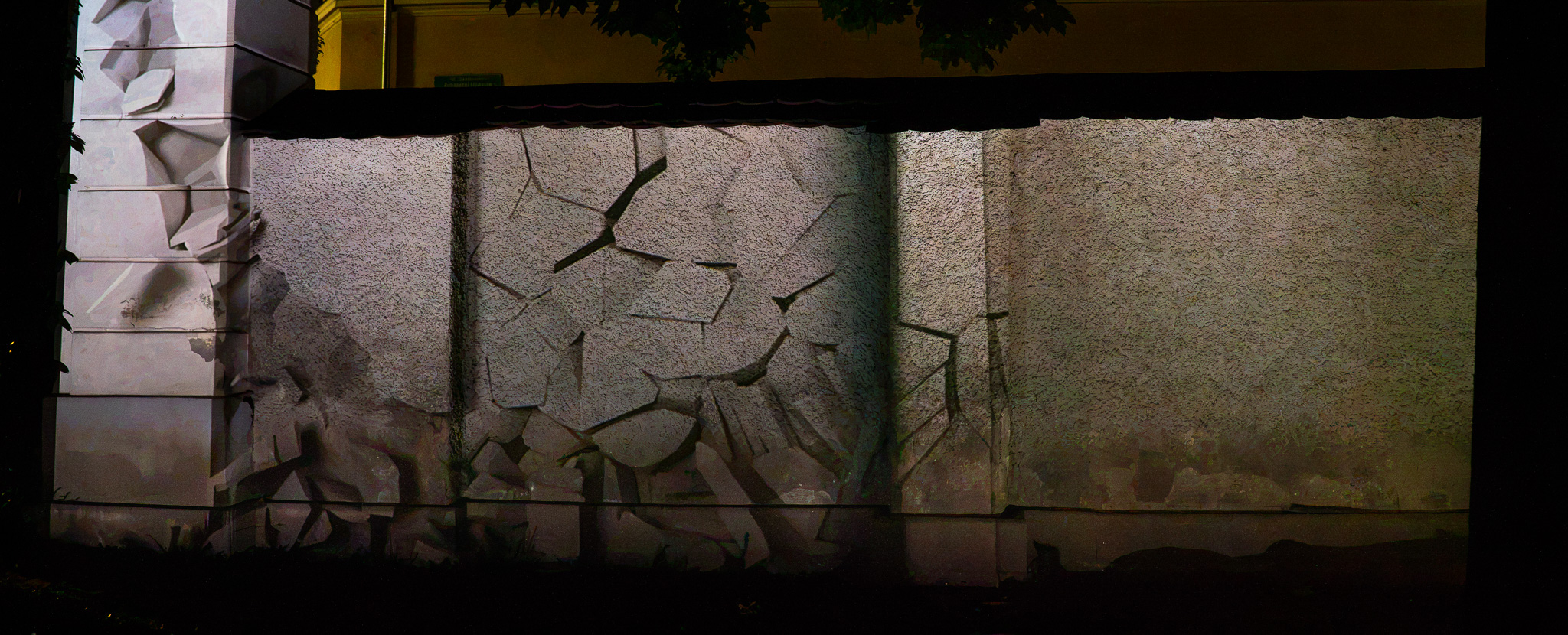 The wall breaking apart in the projection